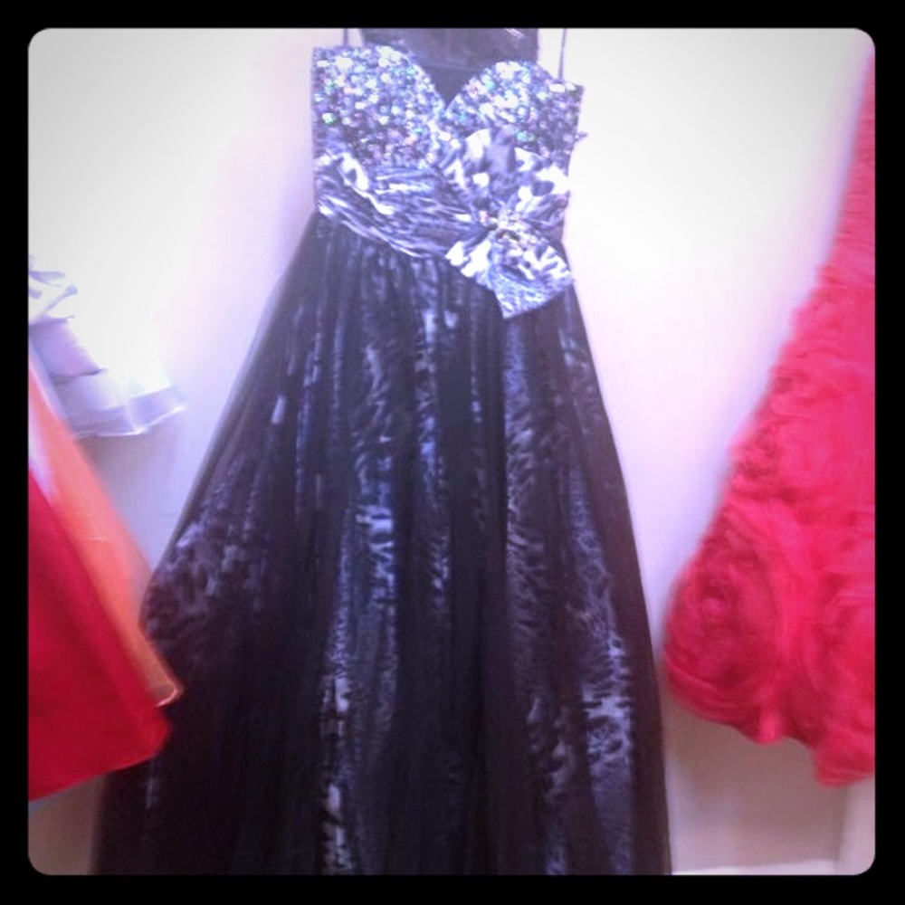 Black ballgown with snow leopard print under New